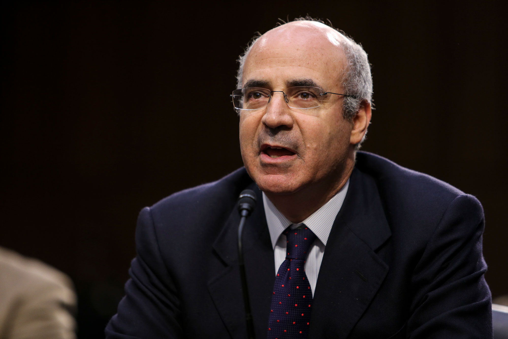 Browder at microphone