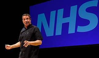 “Mark Thomas: Checkup. Our NHS at 70” leftwing political talk as theater