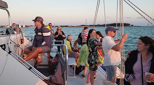 Sebago captain and passengers